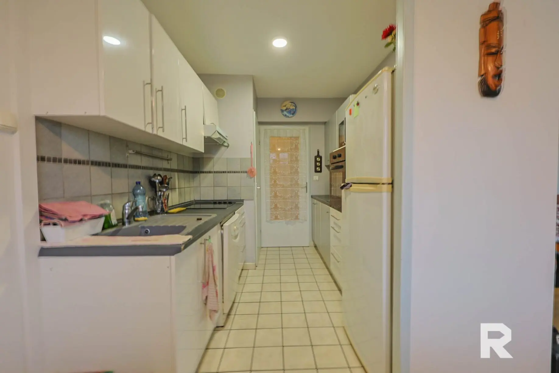 77 Appartement standing – 2 chambres – Garage – Place de parking